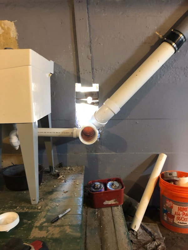 New drain pipe and utility sink installation