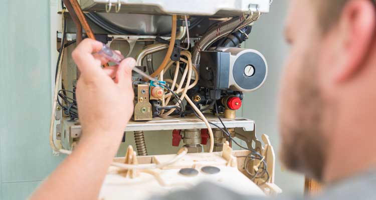 Anne the Plumber boiler repair technician inspecting heating system